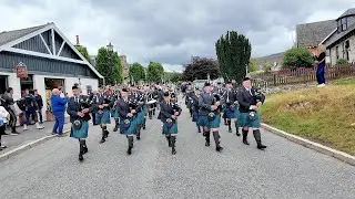 Dunnottar Pipes & Drums playing Crags of Tumbledown on march to 2025 Braemar Gathering in Scotland