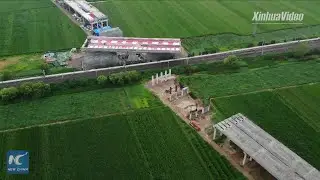 13,000-tonne bridge section rotates successfully in central China