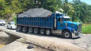 Loaded trucks crossing FlatBridge the most popular and dangerous bridge in Jamaica 🇯🇲