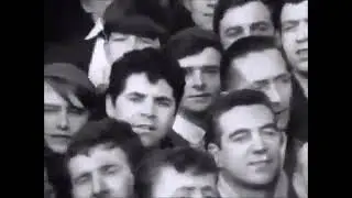 Liverpool fans on the Kop sing &lsquo;She Loves You&rsquo; by The Beatles in 1964.