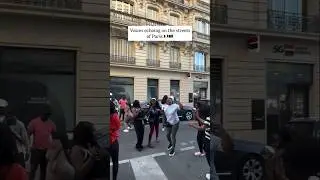 South African students singing Uthando in the streets of Paris by Thanda Choir
