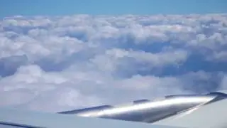 Air plane climbing through the clouds