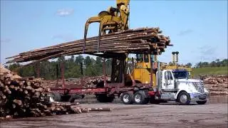 Log Stacker Unloading Tractor Trailer