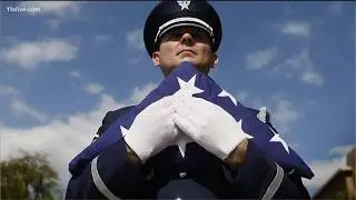 Why the flag is folded into a triangle?