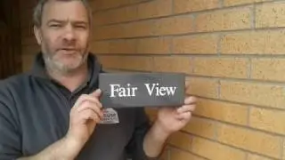 Guide to fitting a slate house sign to a wall