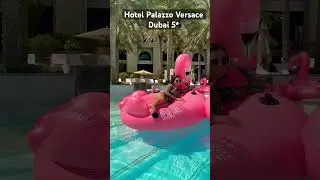 Hotel Palazzo Versace Dubai 5*. Beautiful Girls on Red flamingo in pool
