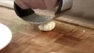 ERGONOMIC STAINLESS STEEL GARLIC PRESS - IT'S UH-MAZING!