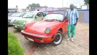Restoring the only Porsche 911 in Ibadan.  The little red driving in the hood