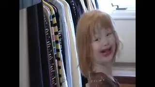 Emma age 3 putting on lipstick
