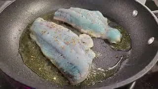 Cooking rock greenling.   Turning from blue to white.