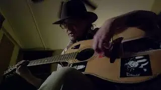 Pennies in a guitar case by Ed Gonzales