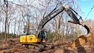 Clearing the remainder of the proposed dam on the 1950 pond project.