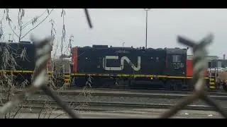 CN Locals EMD GP38-2 4958 GP38-2 4719 & GP9RM 7058 are backing it up the Intermodal Containers 