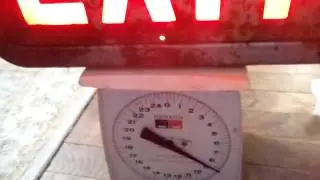 Exit Sign Weight Comparison: 1950's vs. 2010