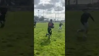 Player hurdles over another player at adult league football tournament for a touchdown!