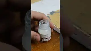 Applying gold leaf on canvas