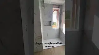 Realizzazione bagno effetto marmo e parquet.