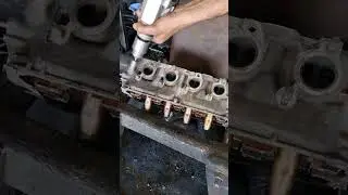 Engine cylinder head cleaning grinder wire brush.