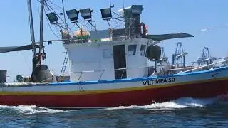 Maltese fishing boat (with modern 'lampara') returning to port