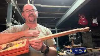 Nut height and string intonation on a cigar box guitar