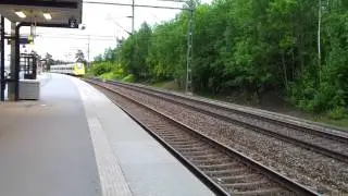 Arlanda Express passing through Helenelund Station