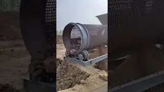 Shaftless roller screening machine can screen soil and small stones.