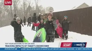 11:40 a.m. winter storm update || Family braces the cold to go sledding