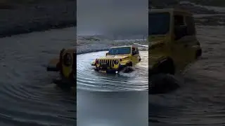 jeep Rubicon JL crossing deep water.