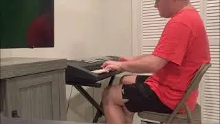 Nick playing the keyboard with 2 hands