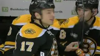 Milan Lucic hits Mike Van Ryn through the Glass