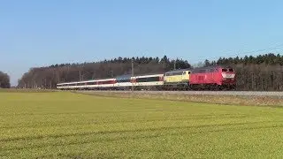 218 402 (orientrot mit Latz) und 218 460 (ozeanblau/beige) mit EC&acute;s auf der Allg&auml;ubahn