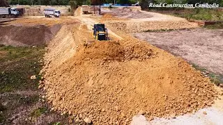 SHANTUI Dozer Pushing Soil Building Foundation New Road To Village And Dump Truck Unloading Soil