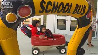 Red wagon & red carpet rolled out for first day of school at Ana Grace Academy
