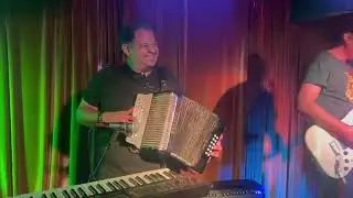 Playing “Vato Perron” with friends at open mic night 