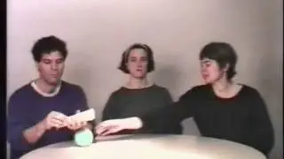 Man rolls a tortilla and then a woman takes a ball from the man.