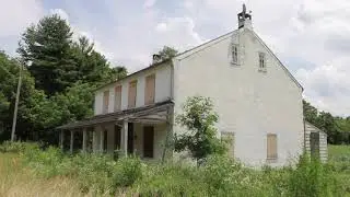 Abandoned Train Station, Houses, And NS Freight  Train.