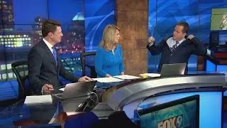 Meteorologist leaves hanger in his suit