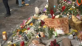 People gather at memorial site of the woman killed by ICE agent | AFP