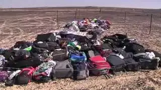 At Egypt crash scene, suitcases piled near charred wreckage