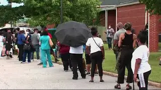 What caused the long lines at polling centers in Georgia?