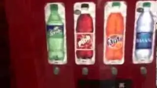 Sprite from a vending machine:a coke,gaderade & water machi