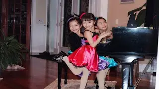 RMA Students Wenlee Vazquez (6), Zimo Wen (7)and Julia Mu (8) perform Out...Standing! by Kevin Olson