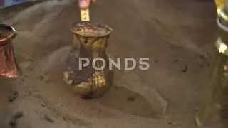 Close-Up Of Coffee Being Heated In The Sand, stock video