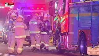 Two female firefighters hospitalised after factory fire south of Brisbane