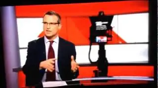 BBC News Robot Camera stalks reporter.