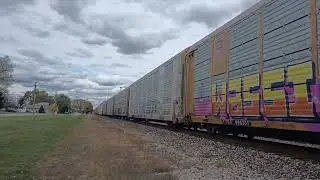 BNSF 4606 C44-9W leads a long Autorack train