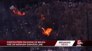 Firefighters work to contain brush fire on Wenham-Danvers line