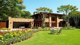 A Harmony of Architecture and Nature: A Luxury House with a Captivating Flower Garden