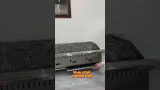 Outdoor gas grill with side burner