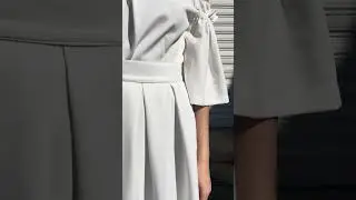 Ruffled white dress with cut-out sleeves and a removable kilt skirt